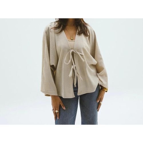 أناقة طبيعية: كارديجان حريمي بيج من الكتان لإطلالة راقية وعصرية